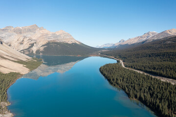 Aerial view of Bow Lake and the reflection of Mount Jimmy Simpson