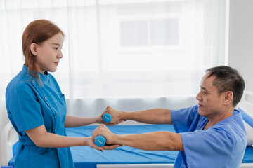Physical therapy assistance Asian female doctor with senior man in physical therapy rehabilitation...