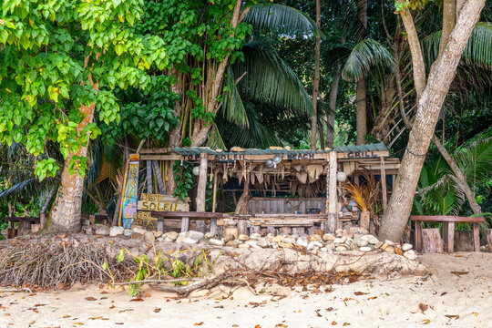 Top Soleil, Beach bar under trees on a sandy beach on the tropical island of Mahé, Seychelles