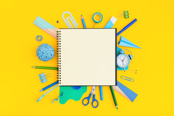 School notebook on supplies on yellow table top view. Back to school, creative concept, flat lay.	