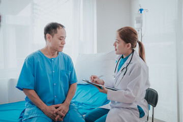 Young Asian female doctor talking with elderly man Provide care and assistance to patients in hospital beds Elderly health care and medicine