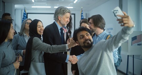 Happy diverse people take pictures with mature presidential candidate after voting. Multiethnic US...