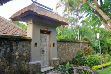 Traditional balinese handmade carved wooden door. Bali style furniture with ornament details