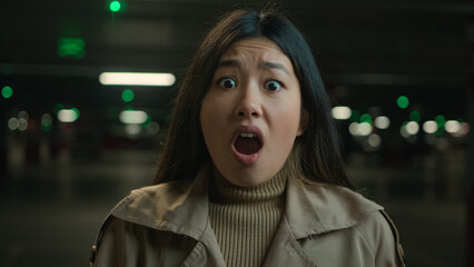 Afraid girl Asian chinese japanese woman shocked bad news frightened korean lady in car parking...