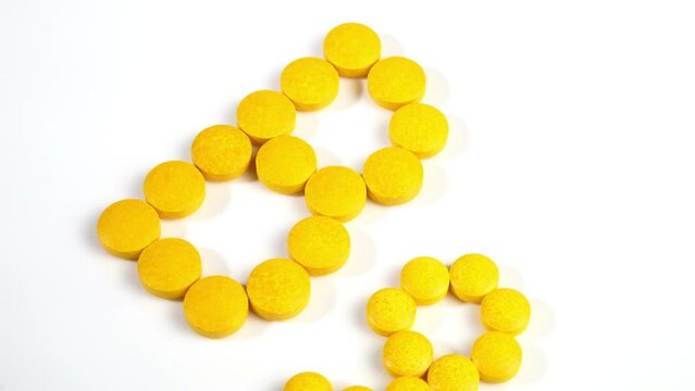 Vitamin B9 Pills isolated on white background