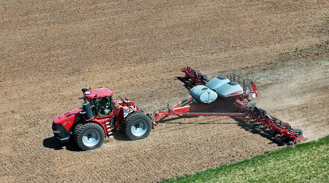 Avon, WI - USA -  April 15, 2024.Case 420 Steiger tractor pulling a.Case 2150 24 row planter