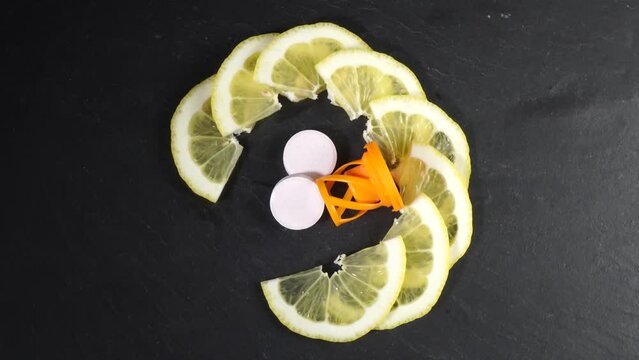 Vitamin C effervescent tablet - Tablets with pieces of lemon fruit