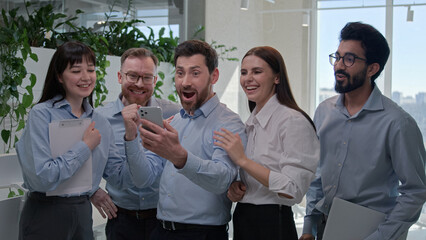 Happy excited surprised business team corporate businessmen businesswomen celebrate victory at...