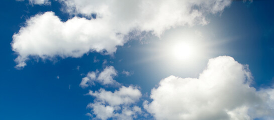 Bright sun on a blue sky. Wide photo. - 788417670
