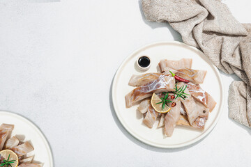 Raw pollock (Pollachius virens) fillet. Fresh fish for healthy food lifestyle. Spices and herbs