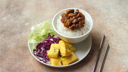 Rice with chicken fillet black pepper served with omelet and vegetables. Healthy menu. Dietetic...
