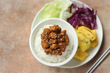 Rice with chicken fillet black pepper served with omelet and vegetables. Healthy menu. Dietetic menu. 