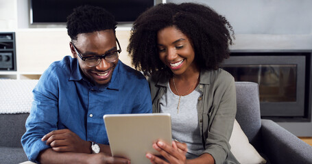 Black couple, tablet and smile for social media on sofa in living room of home for browsing together. App, love or relax with happy young man and woman in apartment for post or status update