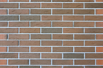 Brown brick wall texture with white grout