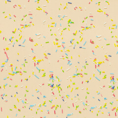 Trendy pattern of colorful sprinkles on bright background. Concept for decoration cake and bakery.