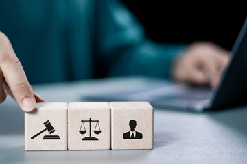 Legal advice business concept. Businessman holding wooden block with law icon for business legal...