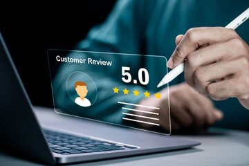 Businessman using laptop give rating to service experience on online application, 5-star satisfaction, satisfaction feedback review, good quality most.