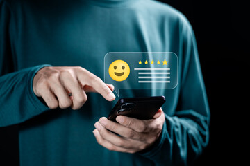 Person using smartphone give rating to service experience on online application, 5-star...