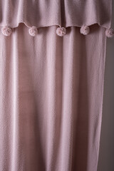 The knitted texture is the same color as a dusty rose.