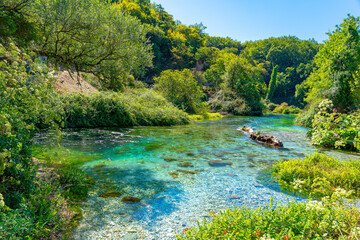 Turquoise and green water in the spring water of the blue eye lake in Albania.