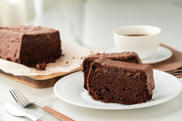 Fresh homemade chocolate sponge cake on wooden board - 788453659
