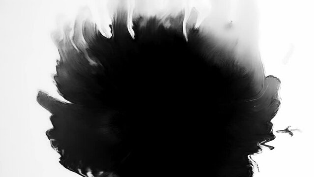 Ink grunge background. Surreal universe. Black glitter liquid splash with spreading copy space on white.