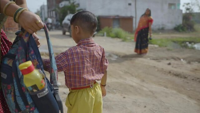 School Day Start: Child Ready for School with Mother's Help, Children Going In The School Stock Video