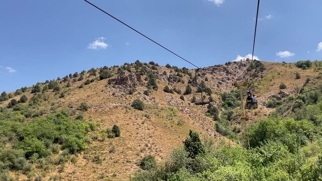 moving up on a chair lift in the summer on the Chimgan mountains