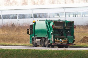 Urban sanitation in progress with a refuse vehicle truck.