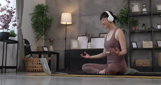 Mature japanese woman practice guided meditation manifestation at home