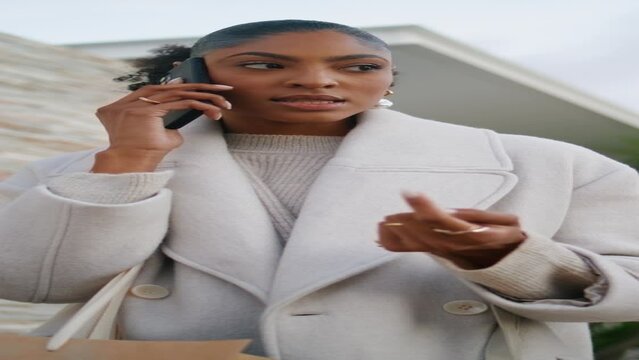 Successful woman talk street vertical. African american get call disconnected