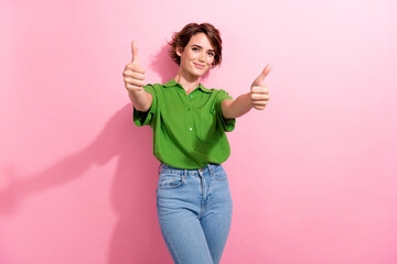 Photo portrait of lovely young lady showing double thumbs up wear trendy green garment isolated on...
