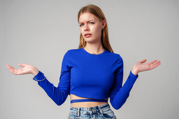 Young Woman in Blue Top Holding Out Hands - 788473442