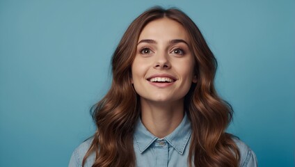 Portrait of attractive curious cheerful brown-haired girl looking up copy empty space clue isolated over bright blue color background - obrazy, fototapety, plakaty