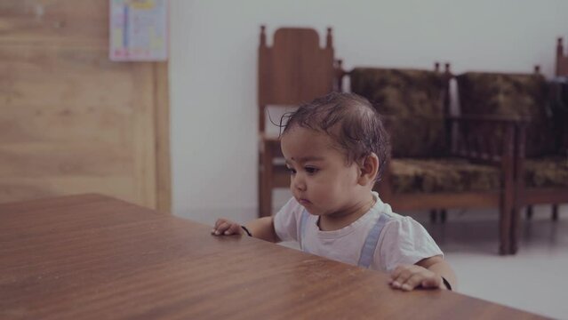 Adorable Baby Girl Standing by Table stock video, indian girl 