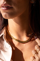 The style of a woman : a golden necklace 