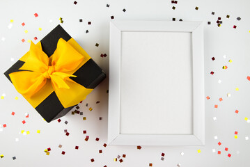 white wooden photo frame and gift box.