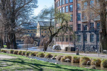 Fototapeta na wymiar Waterfront park Strömparken during early spring in Norrköping. Norrköping is a historic industrial town in Sweden