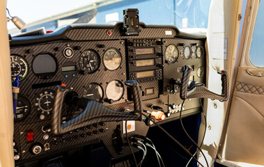 Detail photograph of the interior of a light aircraft cabin. Airplane control equipment.Technology...