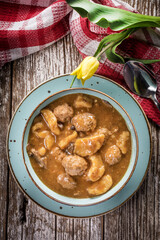 Meatballs in gravy with cast noodles. - 788495603