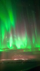 Northern Lights A breathtaking display of Aurora Borealis, with green and purple lights dancing across the night sky