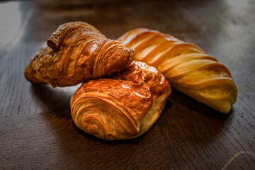 variety of french viennoiseries on wooden surface
