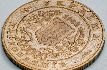 Ukrainian currency, hryvnia, karbovanets, denomination 200,000 with a trident. Macro photo with water drops