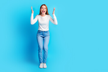 Full body photo of attractive young woman raise hands amazed dressed stylish white clothes isolated...