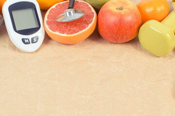 Glucometer for checking sugar level and fresh ripe fruits. Healthy lifestyle. Source minerals and...