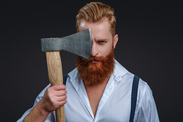 Male brutality. Vintage brutality guy with axe in retro suspenders. Brutal man in suspenders with ax isolated on black. Mature redhead man with hairstyle. Brutal male fashion style. Barbering concept - 788511054