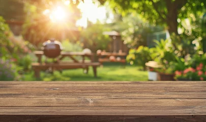 Tuinposter summer time party in backyard garden with grill BBQ, wooden table, blurred background © andreusK