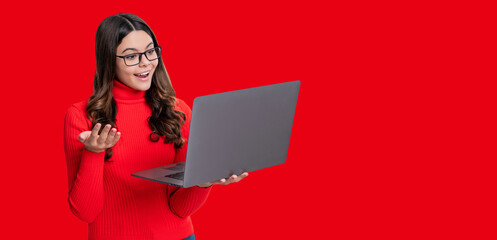 Teen girl study online. Online education. Back to school. Knowledge and online education. Video lesson on laptop. Copy space banner. Teen girl with laptop isolated on red. Remote education - 788514660