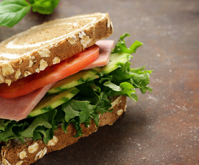 rye bread sandwich with vegetables and ham