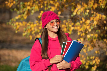 school education of teen girl. knowledge day on september. autumn september is schooling time. september 1. teen girl with school homework. girl enjoy fall outdoor. back to school. Lifelong learning - 788520238